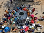 Jaipur residents collect drinking water from a 'Nagar Nigam' tanker due to the ongoing water crisis amid extreme heat, at Jhalana Doongri. (PTI) Jaipur residents collect drinking water from a 'Nagar Nigam' tanker due to the ongoing water crisis amid extreme heat, at Jhalana Doongri. (PTI)