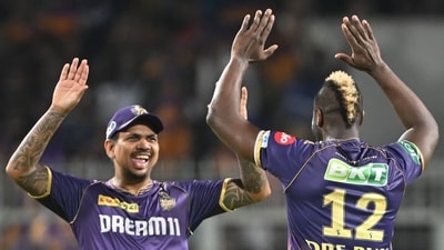 Kolkata Knight Riders' Andre Russell (R) celebrates with teammate Sunil Narine after taking a wicket. (AFP)