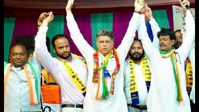 Congress candidate Manish Tewari with party workers after a foot march in Hallomajra, Chandigarh, on Friday. (HT photo)