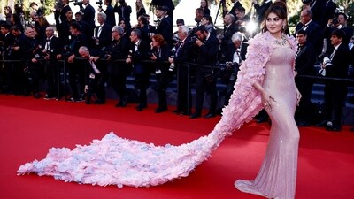 Urvashi Rautela left her fans swooning with yet another stunning look on the Cannes red carpet. Attending the screening of the film 'L'Amour ouf', Urvashi wore a shimmering light pink bodycon gown with a floor-length hemline. Styled with a long floor-sweeping cape adorned with enchanting floral embellishments, she looked straight out of a fairy tale. (REUTERS)