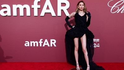 US model and singer Paris Jackson arrived at the annual amfAR Cinema Against AIDS Cannes Gala in a dazzling black ensemble that oozed glamour. Her outfit features a sweetheart neckline, black floral embellishments, a mini hemline and a long train at the back for added drama. Paired with elbow-length black gloves, white floral jewellery and black high heels, she looked simply stunning. (Photo by Sameer Al-Doumy / AFP) US model and singer Paris Jackson arrived at the annual amfAR Cinema Against AIDS Cannes Gala in a dazzling black ensemble that oozed glamour. Her outfit features a sweetheart neckline, black floral embellishments, a mini hemline and a long train at the back for added drama. Paired with elbow-length black gloves, white floral jewellery and black high heels, she looked simply stunning. (Photo by Sameer Al-Doumy / AFP)