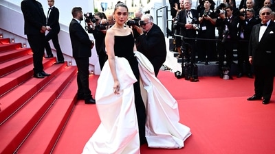 Indian actress Aditi Rao Hydari stunned on the red carpet in a stunning Gaurav Gupta ensemble. Her outfit features an off-the-shoulder neckline, luxurious black velvet fabric and oversized ivory attachments at the sides. Paired with statement pearl earrings and her luscious locks pulled back in a neat bun, she looked like an ethereal princess. (Photo by LOIC VENANCE / AFP) Indian actress Aditi Rao Hydari stunned on the red carpet in a stunning Gaurav Gupta ensemble. Her outfit features an off-the-shoulder neckline, luxurious black velvet fabric and oversized ivory attachments at the sides. Paired with statement pearl earrings and her luscious locks pulled back in a neat bun, she looked like an ethereal princess. (Photo by LOIC VENANCE / AFP)