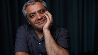Director Mohammad Rasoulof poses for a portrait photograph for the film The Seed of the Sacred Fig at the 77th international film festival, Cannes. (Vianney Le Caer/Invision/AP) Director Mohammad Rasoulof poses for a portrait photograph for the film The Seed of the Sacred Fig at the 77th international film festival, Cannes. (Vianney Le Caer/Invision/AP)