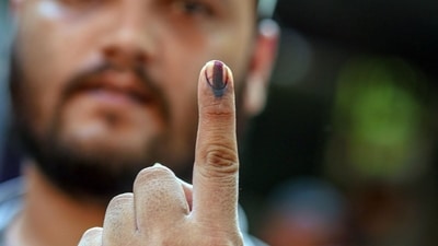 Delhi Lok Sabha Election 2024 phase 6: A voter's finger is marked with indelible ink after casting a ballot at a polling station. (Dhiraj Singh/Bloomberg) Delhi Lok Sabha Election 2024 phase 6: A voter's finger is marked with indelible ink after casting a ballot at a polling station. (Dhiraj Singh/Bloomberg)