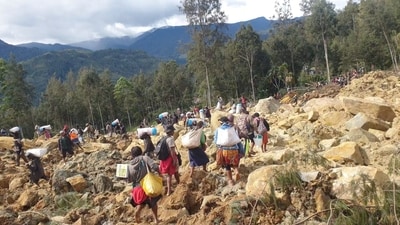 Videos on social media showed residents pulling out bodies buried under rocks and trees. (REUTERS)