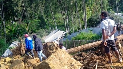 People gather at the site of a landslide in Maip Mulitaka in Papua New Guinea's Enga Province. (AFP) People gather at the site of a landslide in Maip Mulitaka in Papua New Guinea's Enga Province. (AFP)