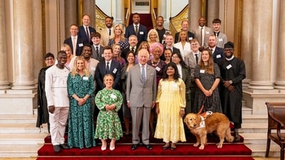 Arti, Pink E-Rickshaw Driver from UP, with King Charles III at a Buckingham Palace reception for Prince's Trust Award winners, in London. (PTI) Arti, Pink E-Rickshaw Driver from UP, with King Charles III at a Buckingham Palace reception for Prince's Trust Award winners, in London. (PTI)