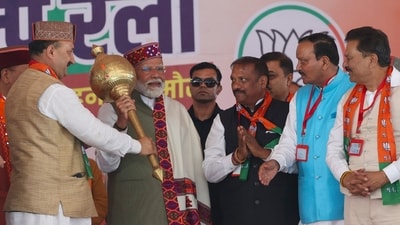 PM Narendra Modi being felicitated during a public meeting for Lok Sabha elections, in Sirmaur district. He outlined his vision for a stronger India and developed Himachal Pradesh. (PTI) PM Narendra Modi being felicitated during a public meeting for Lok Sabha elections, in Sirmaur district. He outlined his vision for a stronger India and developed Himachal Pradesh. (PTI)