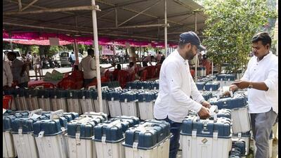 Polling officials with EVMs and other election material in Prayagraj on Friday. (PTI PHOTO) Polling officials with EVMs and other election material in Prayagraj on Friday. (PTI PHOTO)