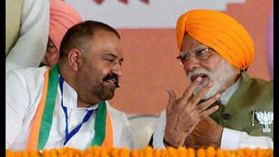 Prime Minister Narendra Modi interacts with BJP’s Jalandhar candidate Sushil Rinku during a public meeting in Jalandhar on Friday. (ANI) Prime Minister Narendra Modi interacts with BJP’s Jalandhar candidate Sushil Rinku during a public meeting in Jalandhar on Friday. (ANI)