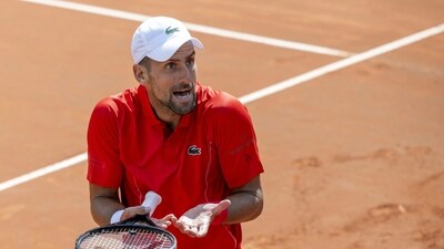 Novak Djokovic, of Serbia, reacts after losing a point as he plays Tomas Machac, of the Czech Republic, during their semi-final match, at the ATP 250 Geneva Open tennis tournament in Geneva, Switzerland, Friday, May 24 (AP) Novak Djokovic, of Serbia, reacts after losing a point as he plays Tomas Machac, of the Czech Republic, during their semi-final match, at the ATP 250 Geneva Open tennis tournament in Geneva, Switzerland, Friday, May 24 (AP)
