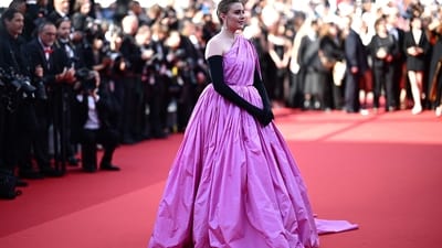 Greta Gerwig, the US director and president of the Jury of the 77th Cannes Film Festival, made a captivating entrance for the screening of the film "L'Amour Ouf" in a mesmerising purple ensemble. Her outfit boasted an off-shoulder neckline and a beautiful flare at the hemline, exuding princess vibes. Gerwig accessorised her look with long black gloves and statement earrings, adding an extra touch of glamour to the red carpet. (Photo by LOIC VENANCE / AFP) Greta Gerwig, the US director and president of the Jury of the 77th Cannes Film Festival, made a captivating entrance for the screening of the film "L'Amour Ouf" in a mesmerising purple ensemble. Her outfit boasted an off-shoulder neckline and a beautiful flare at the hemline, exuding princess vibes. Gerwig accessorised her look with long black gloves and statement earrings, adding an extra touch of glamour to the red carpet. (Photo by LOIC VENANCE / AFP)