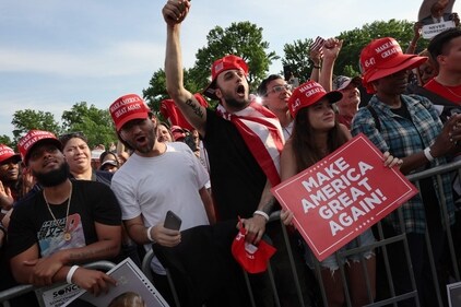 NEW YORK, NEW YORK - MAY 23: Supporters of former President Donald Trump watch as he holds a rally in the historical Democratic district of the South Bronx on May 23, 2024 in New York City. The Bronx, home to a large Latino community, has been a Democratic base for generations of voters and the rally comes as Trump looks to attract more non-white voters. (Getty Images via AFP) NEW YORK, NEW YORK - MAY 23: Supporters of former President Donald Trump watch as he holds a rally in the historical Democratic district of the South Bronx on May 23, 2024 in New York City. The Bronx, home to a large Latino community, has been a Democratic base for generations of voters and the rally comes as Trump looks to attract more non-white voters. (Getty Images via AFP)