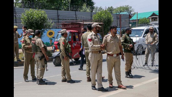Police and security personnel stand guard as preparations for the sixth phase of the Lok Sabha polls are underway, in Anantnag on Friday. (ANI)