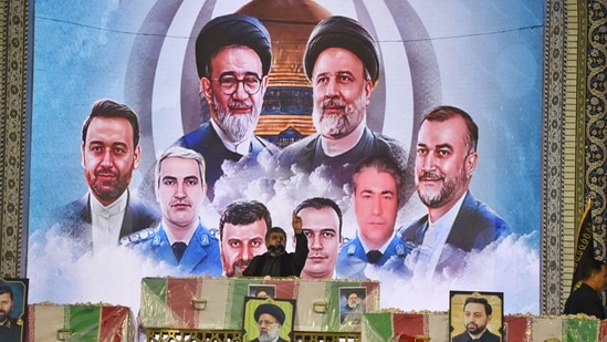 Iranians carry the coffin of late president Ebrahim Raisi at the Imam Reza shrine during the funeral ceremony in the city of Mashhad on May 23, 2024. ( (Photo by Sadegh NIKGOSTAR / FARS NEWS AGENCY / AFP))