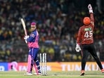 Rajasthan Royals' Shimron Hetmyer (L) is clean bowled as Sunrisers Hyderabad's wicketkeeper Heinrich Klaasen celebrates his dismissal.-