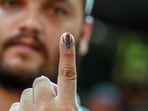 A voter's finger is marked with indelible ink after casting a ballot at a polling station during Lok Sabha election 2024. A voter's finger is marked with indelible ink after casting a ballot at a polling station during Lok Sabha election 2024.