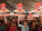 Supporters hold cut-outs of Prime Minister Narendra Modi during an election campaign rally in Gurdaspur. (AFP)