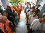 Voters queue up to cast their ballots at a polling station during the sixth phase of voting in India's general election, in village Tigaon on the outskirts of Faridabad on May 25, 2024.(AFP)