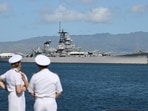 With the USS Missouri batteship memorial in the background, US Navy personnel await the start of the US Indo-Pacific Command (INDOPACOM) change of command ceremony on Kilo Pier at Joint Base Pearl Harbor-Hickam in Honolulu, Hawaii, on May 3, 2024. Incoming commander Admiral Samuel Paparo is replacing outgoing commander Admiral John Aquilino. (Photo by Marco GARCIA / AFP)