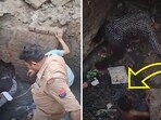 The image shows Noida police rescuing a drunk man from a drainpipe with the help of the locals. 