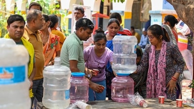 People near drinking water refills at a polling station, as they wait to vote in Saboli, New Delhi. A ‘yellow’ warning was issued in the morning for the day, and the Indian Meteorological Authority (IMD) predicted that temperatures may soar to a maximum of 44 degrees Celsius. The Delhi election authority assured that arrangements have been made to help voters cope with the intense heat. (Sanchit Khanna / Hindustan Times) People near drinking water refills at a polling station, as they wait to vote in Saboli, New Delhi. A ‘yellow’ warning was issued in the morning for the day, and the Indian Meteorological Authority (IMD) predicted that temperatures may soar to a maximum of 44 degrees Celsius. The Delhi election authority assured that arrangements have been made to help voters cope with the intense heat. (Sanchit Khanna / Hindustan Times)