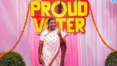 President Droupadi Murmu shows her ink marked finger after voting at Dr. Rajendra Prasad Kendriya Vidyalaya, President’s Estate in New Delhi. (PTI) President Droupadi Murmu shows her ink marked finger after voting at Dr. Rajendra Prasad Kendriya Vidyalaya, President’s Estate in New Delhi. (PTI)
