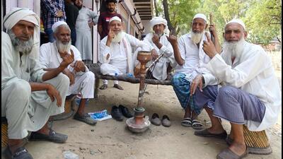 A group of elderly people showing their inked finger after casting their vote in the sixth phase of the Lok Sabha election at a polling station in Ferozepur Namak at Mewat, Nuh on Saturday. (Parveen Kumar/HT PHOTO)