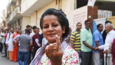 A woman shows her finger marked with indelible ink after casting vote at a polling station during the sixth phase of Lok Sabha elections in Gurugram on Saturday. (PTI) A woman shows her finger marked with indelible ink after casting vote at a polling station during the sixth phase of Lok Sabha elections in Gurugram on Saturday. (PTI)