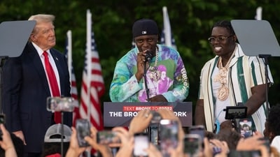 Rappers Sheff G, right, also known as Michael Williams, and Sleepy Hallow, center, also known as Tegan Chambers, join the Republican presidential candidate former President Donald Trump during a campaign rally in the south Bronx, Thursday, May. 23, 2024, in New York. (AP Photo/Yuki Iwamura) (AP) Rappers Sheff G, right, also known as Michael Williams, and Sleepy Hallow, center, also known as Tegan Chambers, join the Republican presidential candidate former President Donald Trump during a campaign rally in the south Bronx, Thursday, May. 23, 2024, in New York. (AP Photo/Yuki Iwamura) (AP)