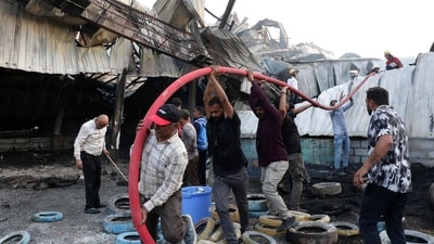 Firefighters try to extinguish a fire which broke out at an amusement park facility in Rajkot, in India's Gujarat state on May 25, 2024.. (Photo by AFP)