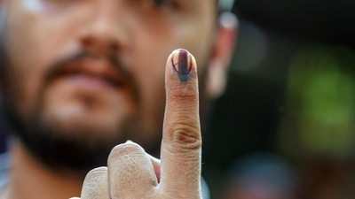 A voter's finger is marked with indelible ink after casting a ballot at a polling station during Lok Sabha election 2024. (Dhiraj Singh/Bloomberg) A voter's finger is marked with indelible ink after casting a ballot at a polling station during Lok Sabha election 2024. (Dhiraj Singh/Bloomberg)