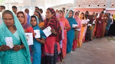 Voters show their identity cards as they wait in a queue at a polling station to cast their votes during the sixth phase of the Lok Sabha elections, in Vaishali district, Saturday. (PTI) Voters show their identity cards as they wait in a queue at a polling station to cast their votes during the sixth phase of the Lok Sabha elections, in Vaishali district, Saturday. (PTI)