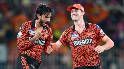 Sunrisers Hyderabad's Shahbaz Ahmed (L) celebrates with captain Pat Cummins (AFP) Sunrisers Hyderabad's Shahbaz Ahmed (L) celebrates with captain Pat Cummins (AFP)