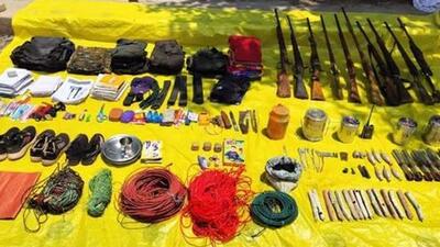 The arms and other items recovered by the security personnel during the encounter (PTI Photo) The arms and other items recovered by the security personnel during the encounter (PTI Photo)