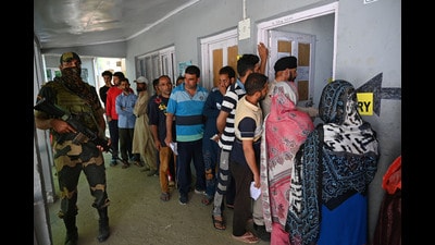 Voters line up at a polling station in the Srigufwara area of Anantnag district on Saturday. (Waseem Andrabi/HT) Voters line up at a polling station in the Srigufwara area of Anantnag district on Saturday. (Waseem Andrabi/HT)