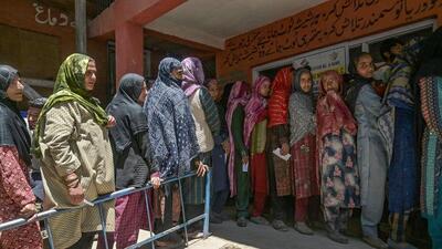 Women outside a polling station in Anantnag. (AFP) Women outside a polling station in Anantnag. (AFP)