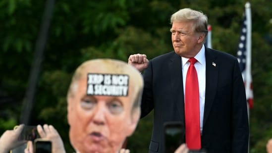 Former US President and Republican presidential candidate Donald Trump walks on stage as he arrives for a campaign rally in the South Bronx in New York City on May 23, 2024. (Photo by Jim WATSON / AFP) (AFP)