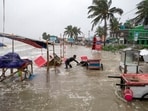 A man salvages a cart and other material as water flows on to the Kuakata beach on the coast of Bay of Bengal caused by the advancing Cyclone Remal in Barisal, Bangladesh, A man salvages a cart and other material as water flows on to the Kuakata beach on the coast of Bay of Bengal caused by the advancing Cyclone Remal in Barisal, Bangladesh,