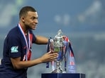 PSG Kylian Mbappe celebrates with the trophy after winning the Coupe de France REUTERS/Catherine Steenkeste