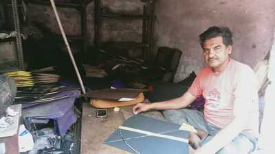 A worker busy making kites at his workshop in Prayagraj (Farhan Ahmed Siddiqui /HT) A worker busy making kites at his workshop in Prayagraj (Farhan Ahmed Siddiqui /HT)
