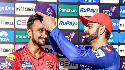 Punjab Kings' Harshal Patel receives the IPL Purple Cap from Royal Challengers Bengaluru's Virat Kohli (PBKS-X) Punjab Kings' Harshal Patel receives the IPL Purple Cap from Royal Challengers Bengaluru's Virat Kohli (PBKS-X)