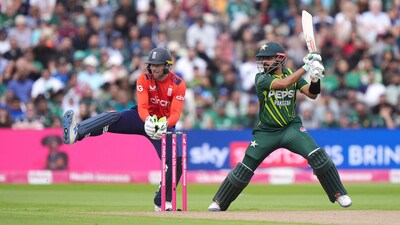 Pakistan's Babar Azam hits out past England wicket keeper Jos Buttler during the second IT20 match at Edgbaston, Birmingham, England, Saturday May 25 (AP) Pakistan's Babar Azam hits out past England wicket keeper Jos Buttler during the second IT20 match at Edgbaston, Birmingham, England, Saturday May 25 (AP)