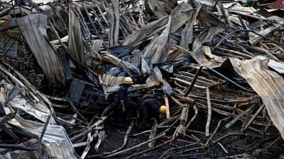 Firefighters searching for victims amidst the debris following a fire in the TRP Gaming Zone in Gujarat’s Rajkot on Sunday. (REUTERS) Firefighters searching for victims amidst the debris following a fire in the TRP Gaming Zone in Gujarat’s Rajkot on Sunday. (REUTERS)