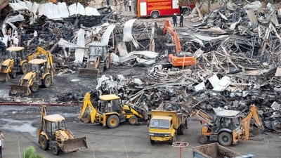 Debris being removed from the game zone site where a major fire on Saturday evening killed at least 27 people and injured three in Rajkot on May 26. (PTI Photo) Debris being removed from the game zone site where a major fire on Saturday evening killed at least 27 people and injured three in Rajkot on May 26. (PTI Photo)