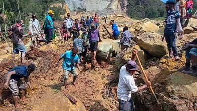 Villagers search through a landslide in Pogera village, in the Highlands of Papua New Guinea, Sunday, May 26, 2024. (AP) Villagers search through a landslide in Pogera village, in the Highlands of Papua New Guinea, Sunday, May 26, 2024. (AP)