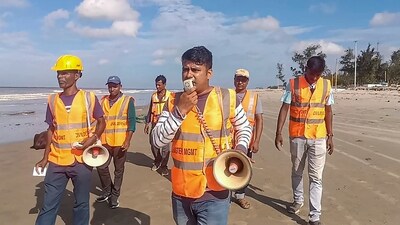 Personnel from West Bengal Disaster Management alert locals ahead of the landfall of cyclone Remal, in South 24 Parganas district. (PTI) Personnel from West Bengal Disaster Management alert locals ahead of the landfall of cyclone Remal, in South 24 Parganas district. (PTI)