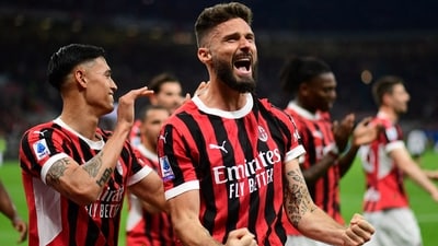 AC Milan's Olivier Giroud celebrates scoring their second goal. (REUTERS)