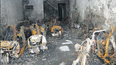 The charred two-wheelers at the parking lot of the building where fire broke out in Krishna Nagar on Sunday. (Arvind Yadav/HT) The charred two-wheelers at the parking lot of the building where fire broke out in Krishna Nagar on Sunday. (Arvind Yadav/HT)