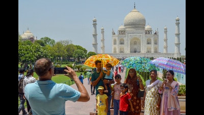 Tourists at the Taj Mahal on a hot summer day, in Agra, Sunday (PTI) Tourists at the Taj Mahal on a hot summer day, in Agra, Sunday (PTI)
